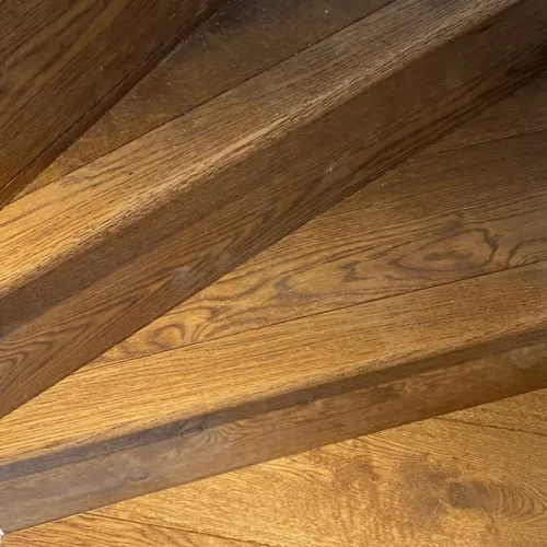 Pine staircase clad in oak aged boards