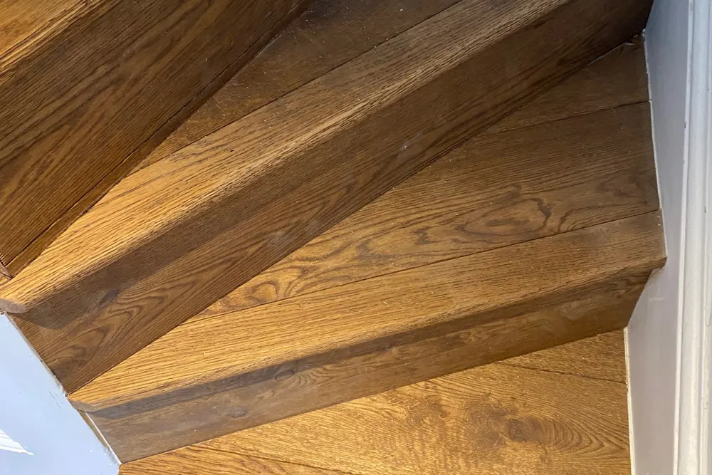 Pine staircase clad in oak aged boards