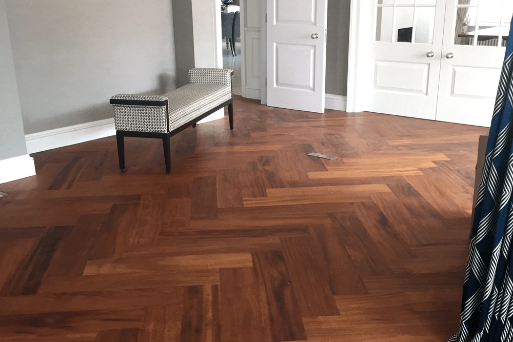 Large Engineered Iroko herringbone over UFH