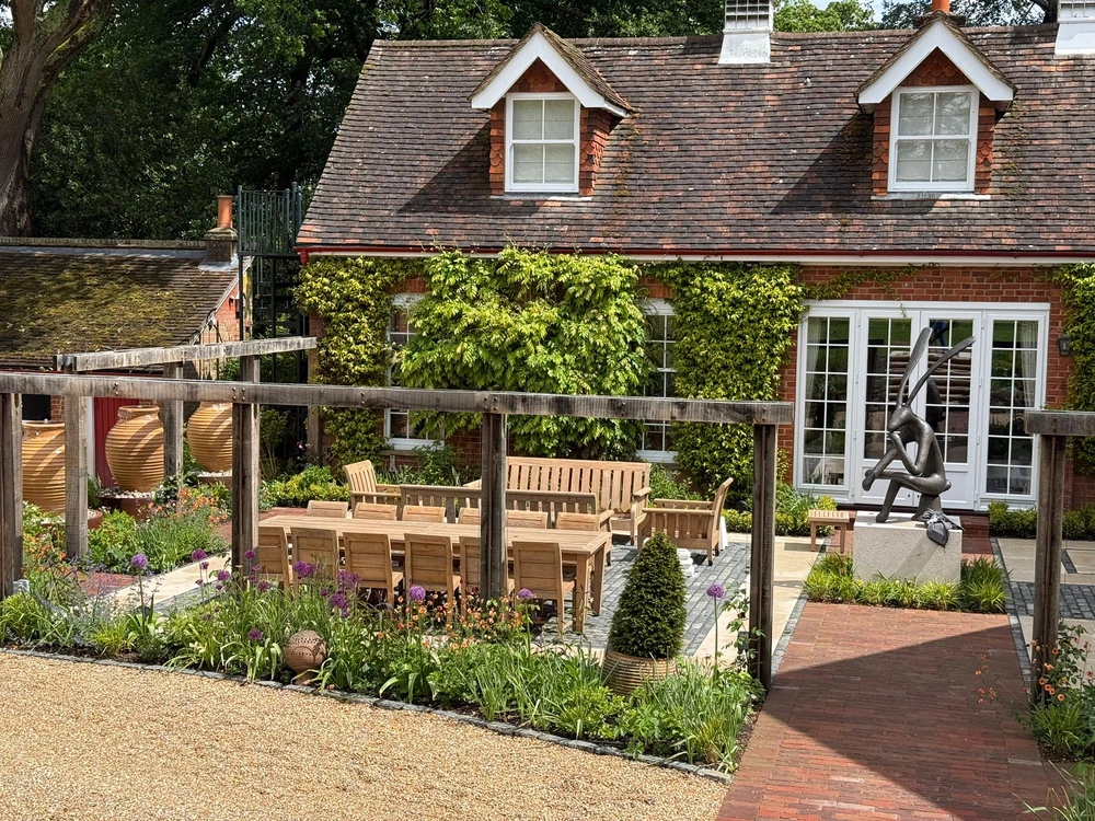 Andrew Banks Wood Furniture restoration - table and chairs on patio in garden restored