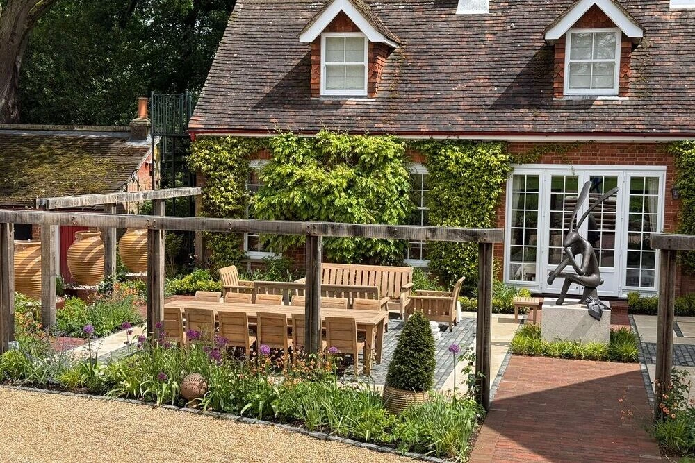 Andrew Banks Wood Furniture restoration - table and chairs on patio in garden restored