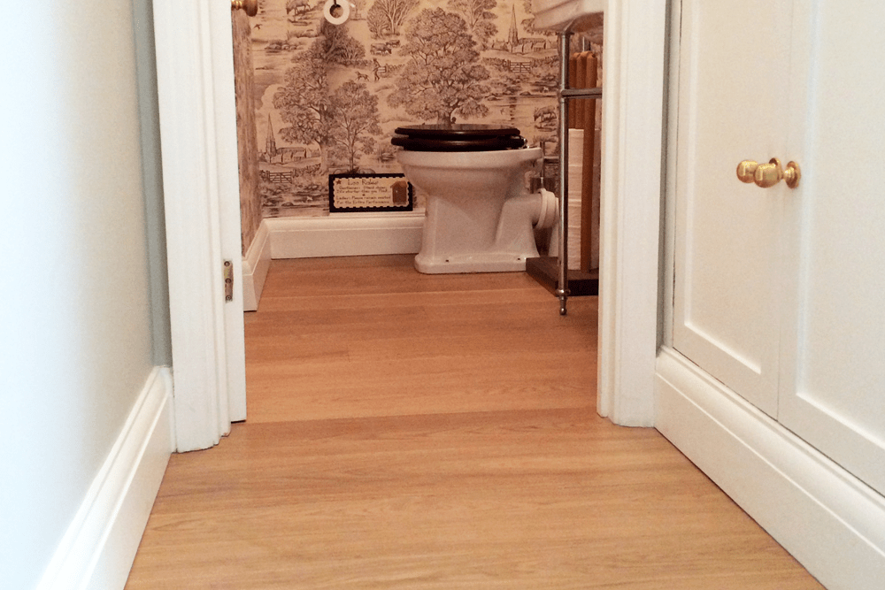 Prime engineered oak in a WC finished with a top coat of Raw Hardwax oil.
