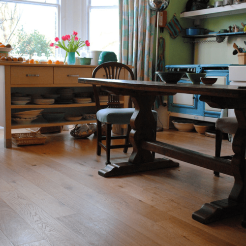 Rustic Grade Oak engineered 148mm plank bevel edged, brushed and oiled floated over old pine floor boards.